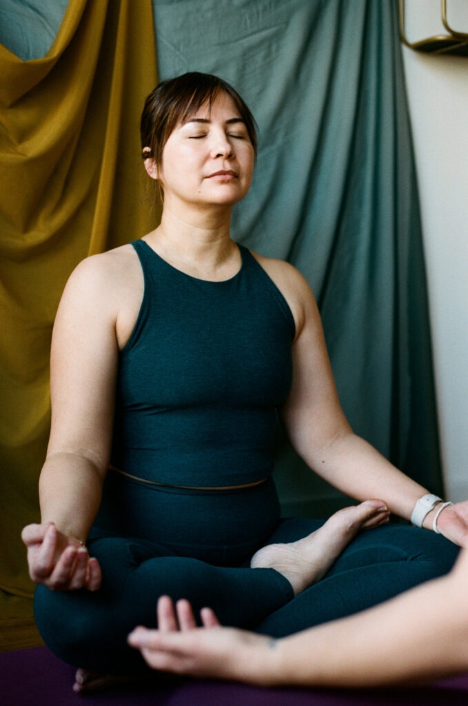 Woman practicing breath work to support nervous system regulation and mental health