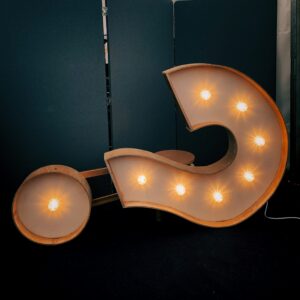 Illuminated question mark symbol representing questions to ask when choosing a therapist and exploring mental health support